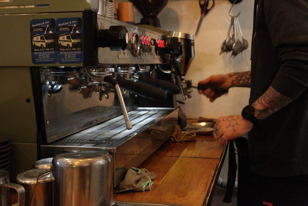 barista making coffee