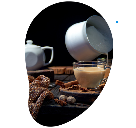 Chai latte pouring in a cup