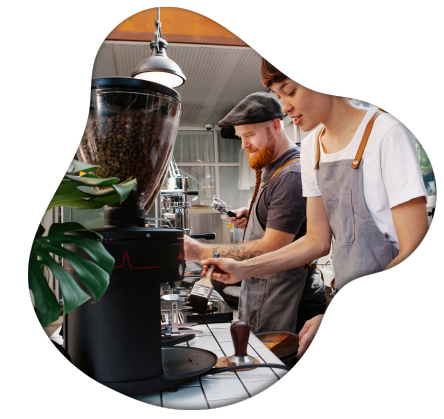 Barista behind a coffee machine