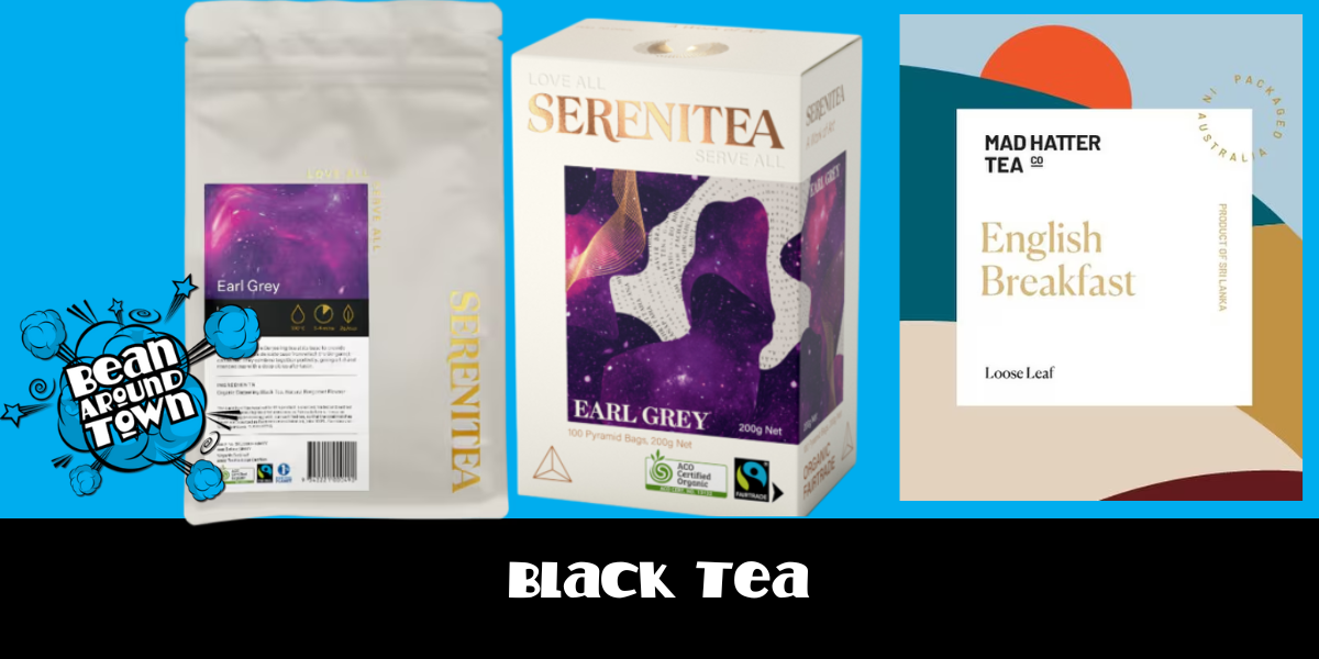 Black tea in a cup beside a box and a bag, showcasing its rich aroma and versatility for various beverages.