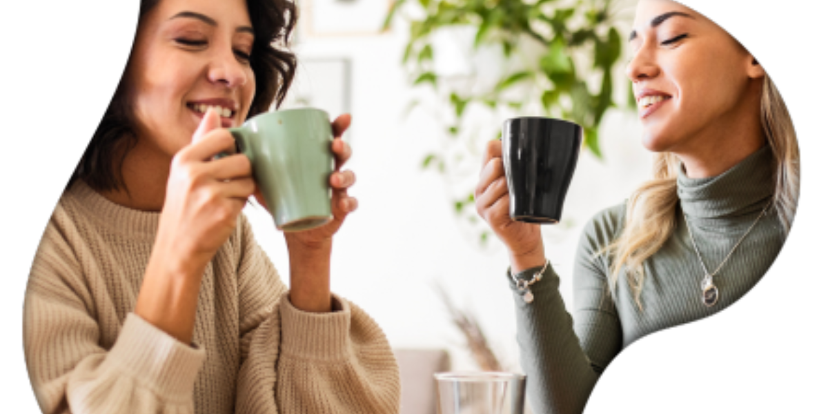 Two women enjoy coffee together at a café, highlighting the social aspect of beverage experiences.